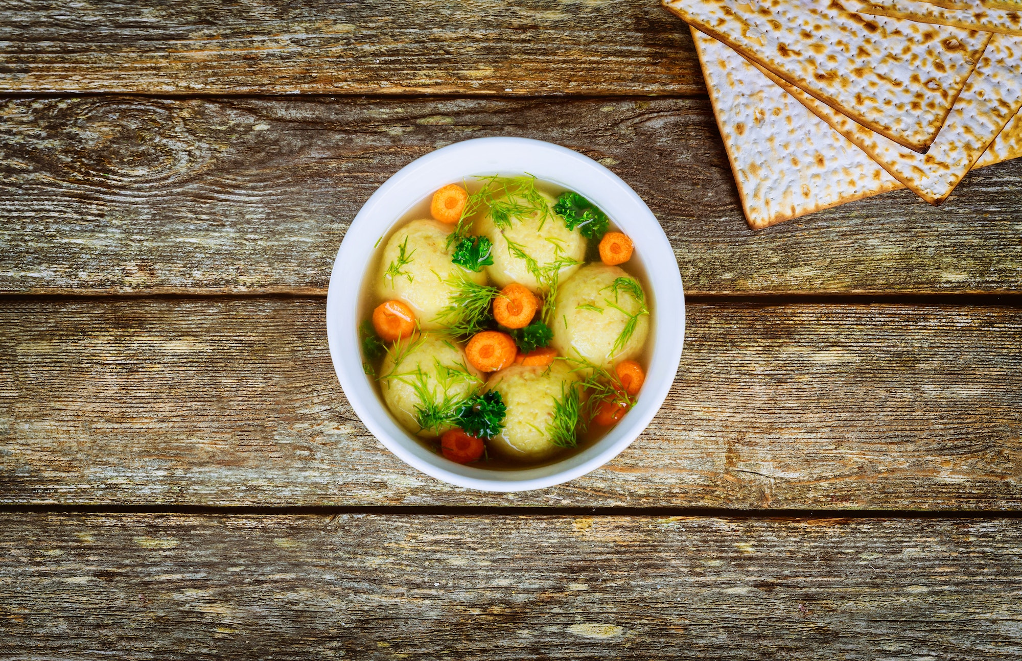 Passover Jewish holiday food homemade Matzo ball soup in a bowl